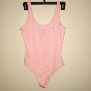 pink body suit